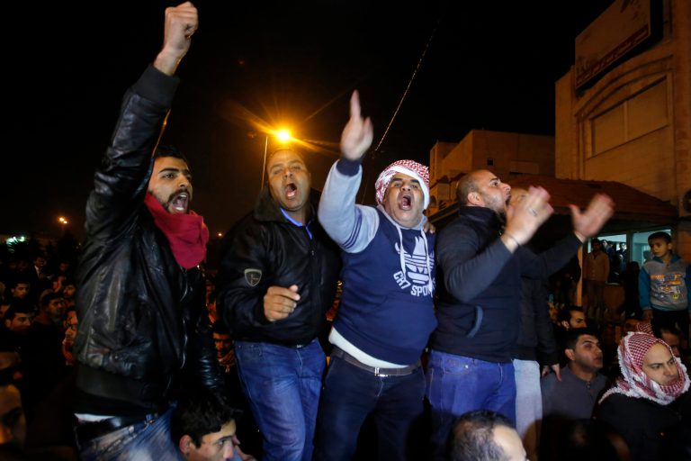 Supporters and family members of Jordanian pilot, Lt. Muath al-Kaseasbeh express their anger of his reported killing, outside the tribal gathering chamber, Amman, Jordan, Tuesday. (AP/Raad Adayleh)
