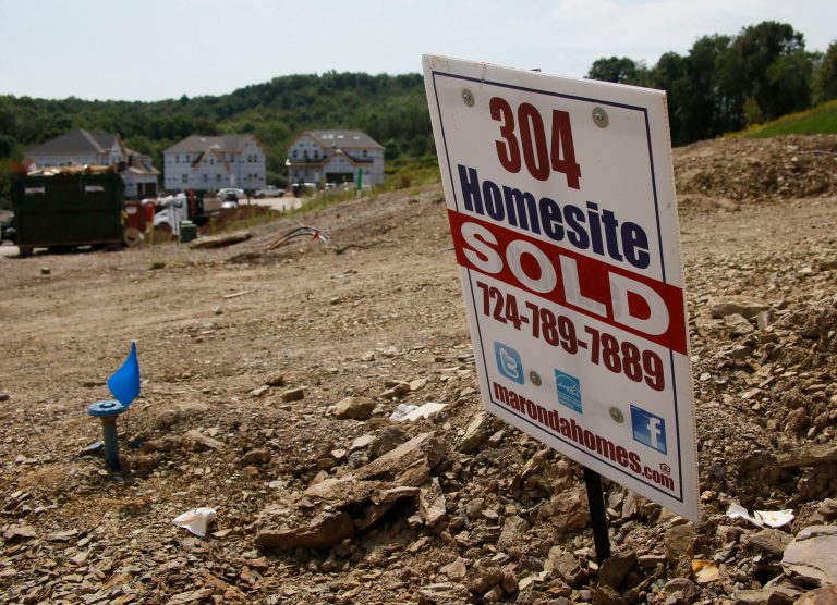 FILE - In this Wednesday, Sept. 10, 2014 file photo, construction is underway at a housing development in Zelienople, Pa. The Commerce Department reports on sales of new homes in August on Wednesday, Sept. 24, 2014. (AP Photo/Keith Srakocic, File)