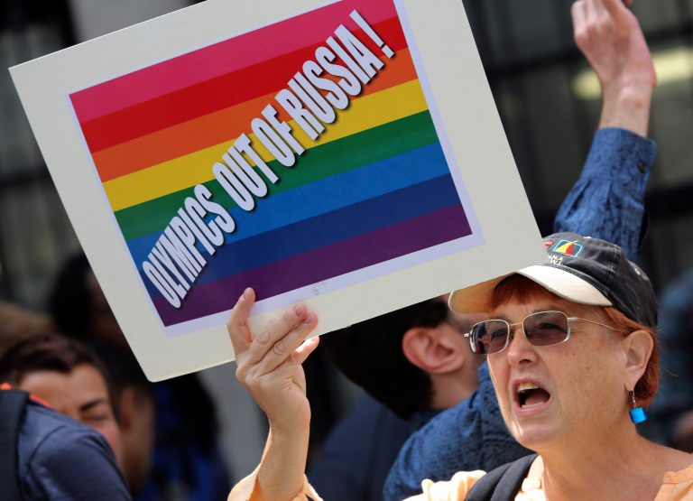 A gay rights activist chant slogans during a demonstration in front of the Russian consulate in New York, Wednesday, July 31, 2013. (AP Photo/Mary Altaffer)