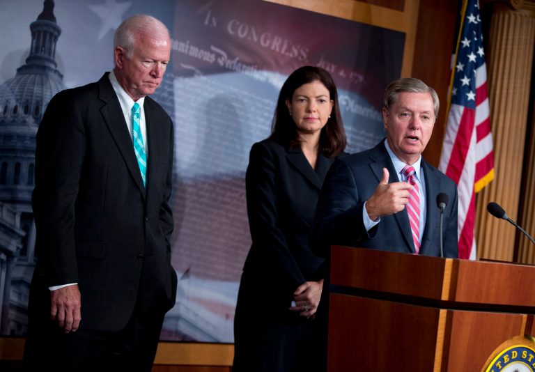 Sen. Lindsay Graham, R-S.C., right, accompanied by Senate Intelligence Committee Vice Chairman Sen. Saxby Chambliss, R-Ga., left, and Sen. Kelly Ayotte, R-N.H., gestures during a news conference on Capitol Hill in Washington, Tuesday, Oct. 8, 2013, to discuss the capture of terrorism suspect Abu Anas al-Libi. The Senators are pleading with the Obama administration to send al-Libi to Guantanamo Bay detention center for interrogation rather than sending him to New York for a trial. (AP Photo/ Evan Vucci)