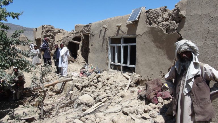 Afghan villagers gather near a house destroyed in an apparent NATO raid in Logar province, south of Kabul, Afghanistan on Wednesday, June, 6, 2012. (AP Photo/Ihsanullah Majroh)