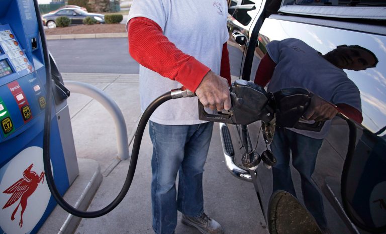 The average driver saved $550 at the pump, AAA reported Thursday, thanks to low prices caused by a glut of crude oil. (AP Photo/Stephan Savoia)