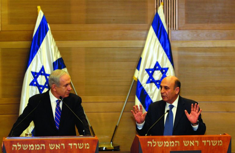 FILE- In this May 8, 2012 file photograph, Israel's Prime Minister Benjamin Netanyahu, left, and Kadima party leader Shaul Mofaz hold a joint press conference in Jerusalem. Israel plunged toward a political crisis Tuesday, July 17, 2012, after the Kadima Party, the largest party in the government quit, leaving Prime Minister Benjamin Netanyahu in charge of a hard-line coalition opposed to most Mideast peace moves. The moderate Kadima Party voted to pull out of the government in a feud over attempts to reform the country's military draft. (AP Photo/Sebastian Scheiner, File)