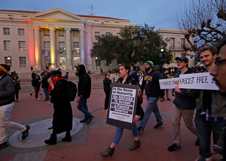 People march in front of Sproul Hall to protest the appearance of Breitbart News editor Milo Yiannopoulos on Wednesday, in Berkeley, Calif. (AP Photo/Ben Margot)