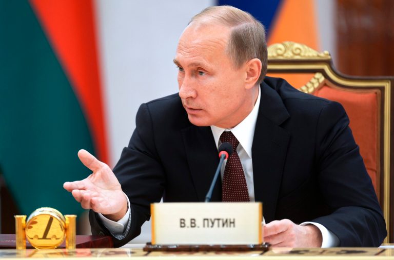 Russian President Vladimir Putin speaks to the leaders of ex-Soviet states during a meeting in Minsk, Belarus, Friday, Oct. 10, 2014. (AP Photo/RIA-Novosti, Alexei Nikolsky, Presidential Press Service)