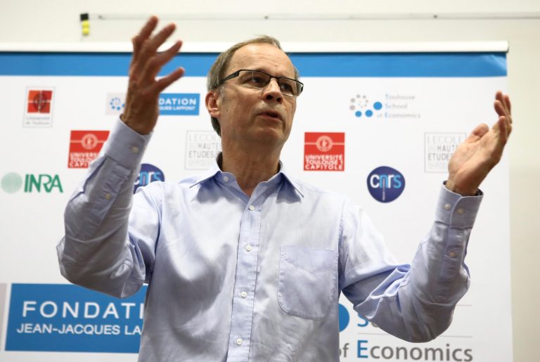 French economist and Nobel Prize laureate Jean Tirole addresses the media during a press conference at the Toulouse School of Economics in Toulouse, southern France, Monday, Oct. 13, 2014. Tirole won the Nobel prize for economics Monday for research on market power and regulation that has helped policy-makers understand how to deal with industries dominated by a few powerful companies. (AP Photo/Fred Scheiber)
