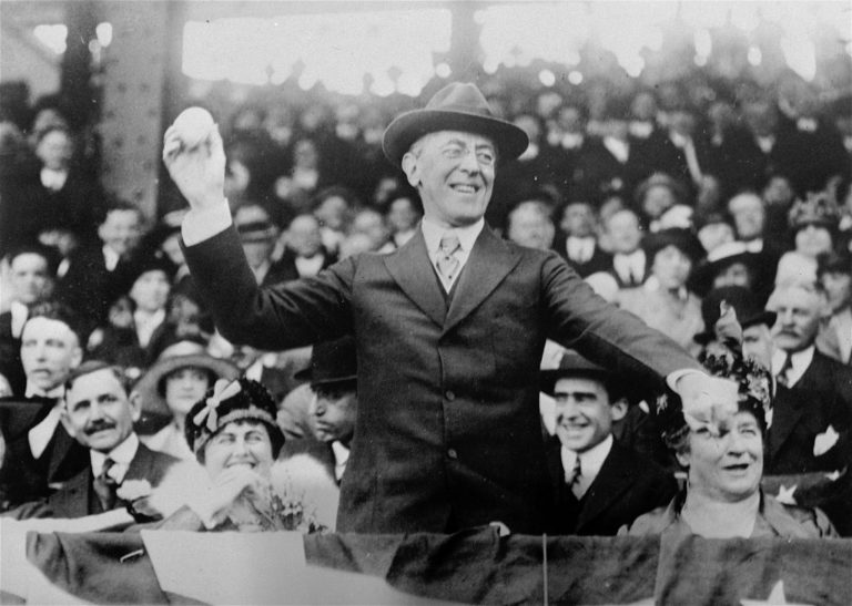 Surrounded by crowds, President Woodrow Wilson throws out the first ball at a baseball game in Washington in this 1916 photo. (AP Photo)
