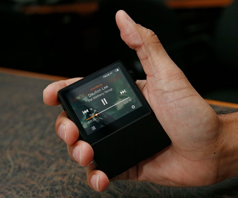   In this Monday, Dec. 17, 2012 photo, the Astell & Kern AK100, is displayed for a photographer in Atlanta. The Astell & Kern AK100 is a portable music player retailing for $699 and is capable of playing 24-bit, audiophile-quality digital music files. (AP Photo/John Bazemore)  