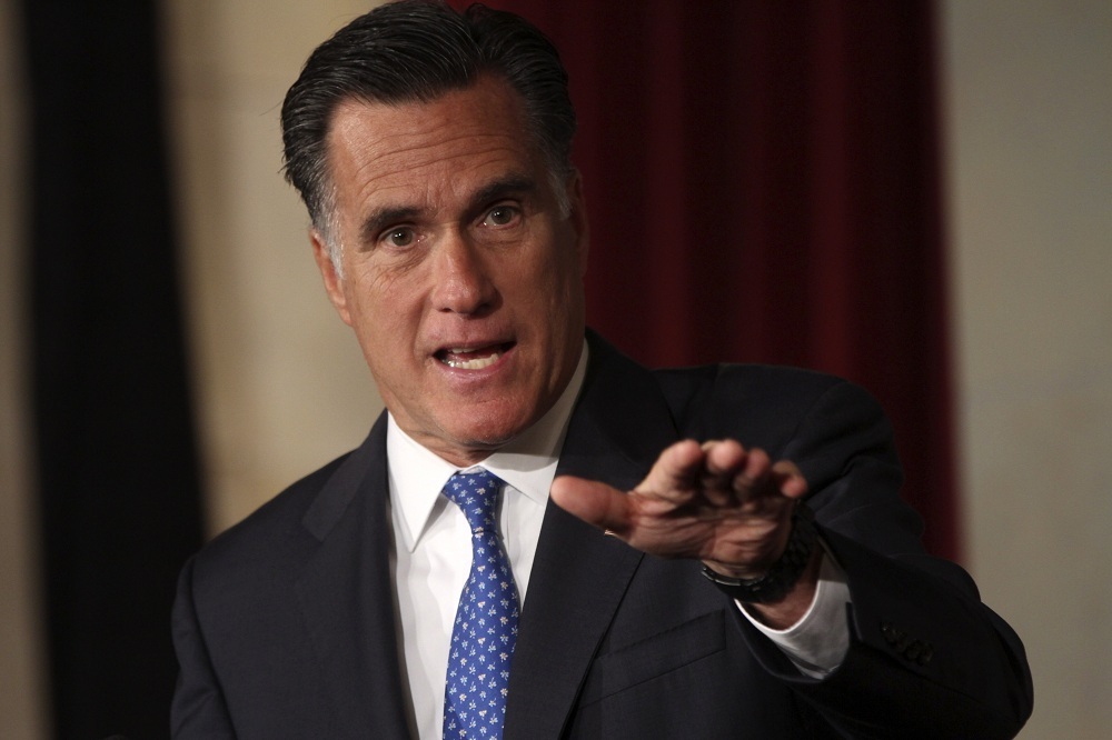 Romney turns focus to education, assails unions