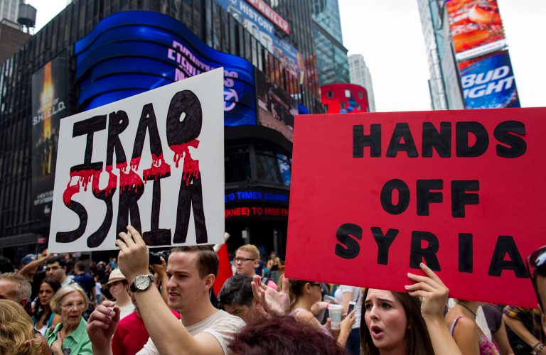 Protesters around the world took to the streets Saturday to protest for and against a possible U.S.-led attack on Syria as President Barack Obama announced he would seek congressional approval for such a move. (AP/Craig Ruttle)