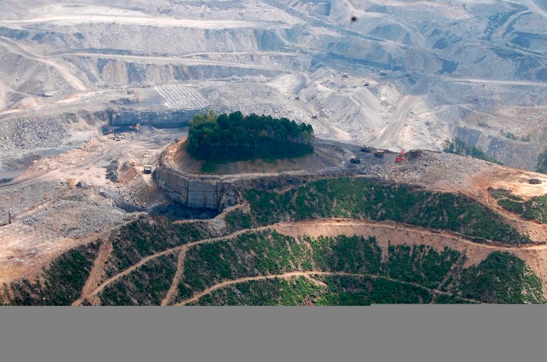 A June 2010 aerial photo released by the Ohio Valley Environmental Coalition shows mining equipment on a mountain top near a cemetery. (AP Photo/Ohio Valley Environmental Coalition, Maria Gunnoe)