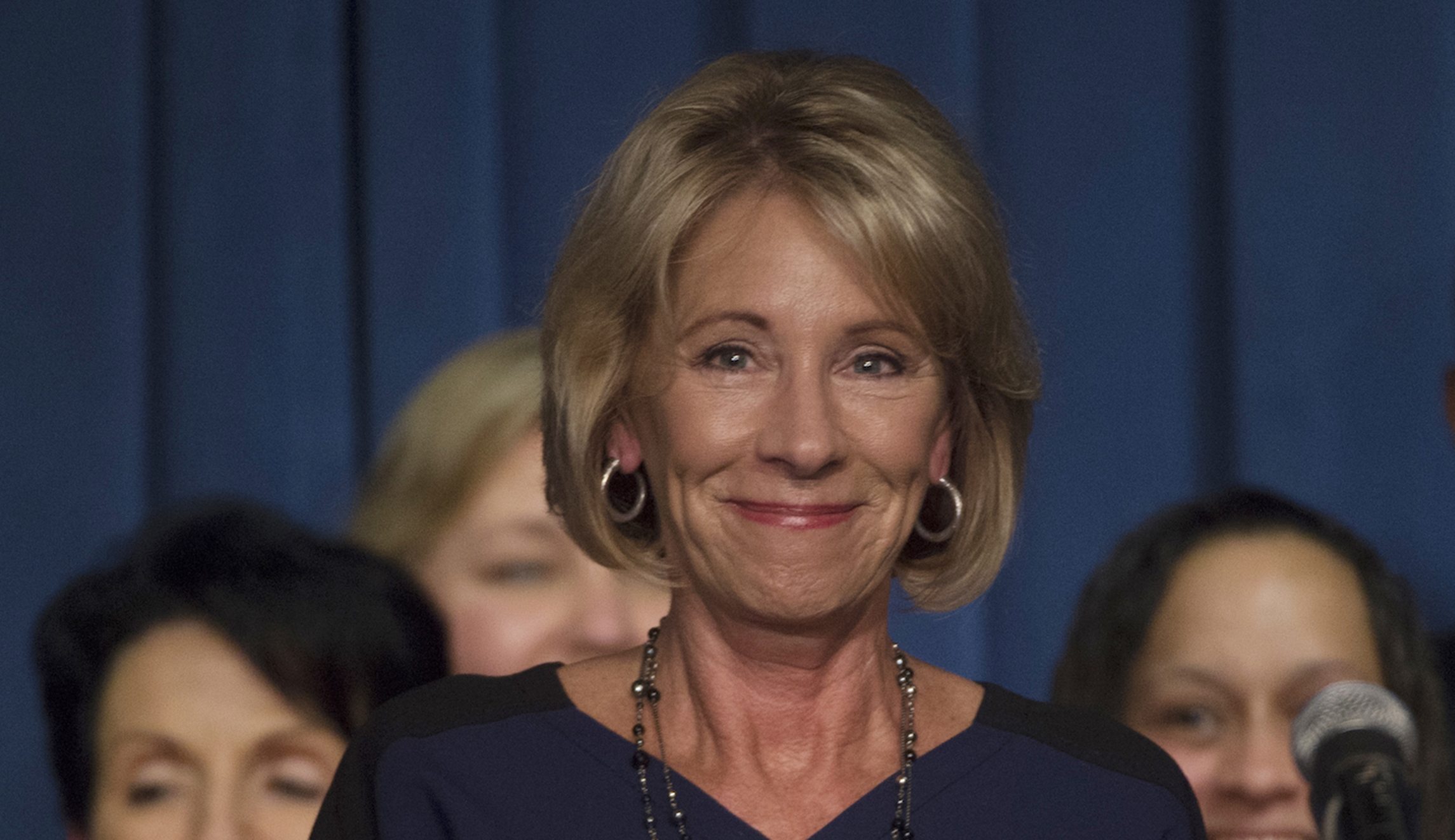 Why do some Harvard students believe Betsy DeVos is a white supremacist?