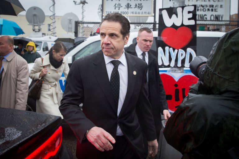 New York Gov. Andrew Cuomo leaves the wake of New York Police Department officer Wenjian Liu at the Aievoli Funeral Home, Saturday, Jan. 3, 2015, in the Brooklyn borough of New York. (AP Photo/John Minchillo)