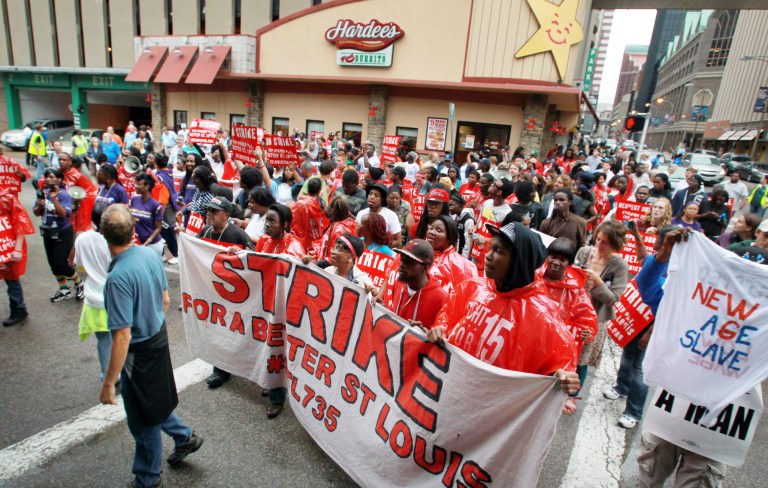 Fast food workers have been protesting this summer, demanding higher wages. (AP Photo/Belleville News-Democrat, Derik Holtmann)