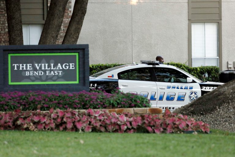 Dallas Police patrol the entrance to The Village Bend East apartments where a second healthcare worker tested positive for Ebola, Wednesday, Oct. 15, 2014, in Dallas.  The worker at Texas Health Presbyterian Hospital was monitoring herself for symptoms, Dallas County Judge Clay Jenkins said. The unidentified woman reported a fever Tuesday. She was in isolation within 90 minutes, Jenkins said. (AP Photo/Brandon Wade)