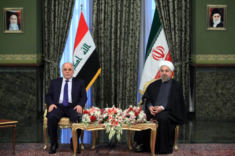 Iraqi Prime Minister Haidar al-Abadi, left, meets with Iran's President Hassan Rouhani, at Tehran's Saadabad Palace on Tuesday, Oct. 21, 2014. Iranian troops have been fighting alongside Iraqi forces for months but this week marks the first time the U.S. has confirmed Iranian air activity. (AP Photo/Ebrahim Noroozi)