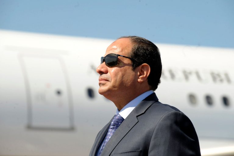 Egyptian President Abdel-Fattah el-Sissi stands at Algiers airport as he arrives for a visit in Algiers, Wednesday, June 25, 2014. El-Sissi is expected to meet with Algerian President Abdelaziz Bouteflika. (AP Photo/Sidali Djarboub)