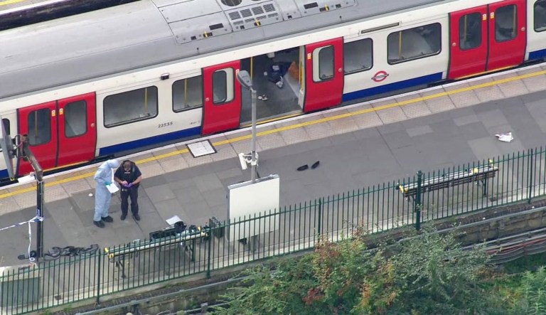 Forensic officers work at the Parsons Green Underground Station after an explosion in London Friday. The police said they were investigating it as a terrorist attack. (Pool via AP)