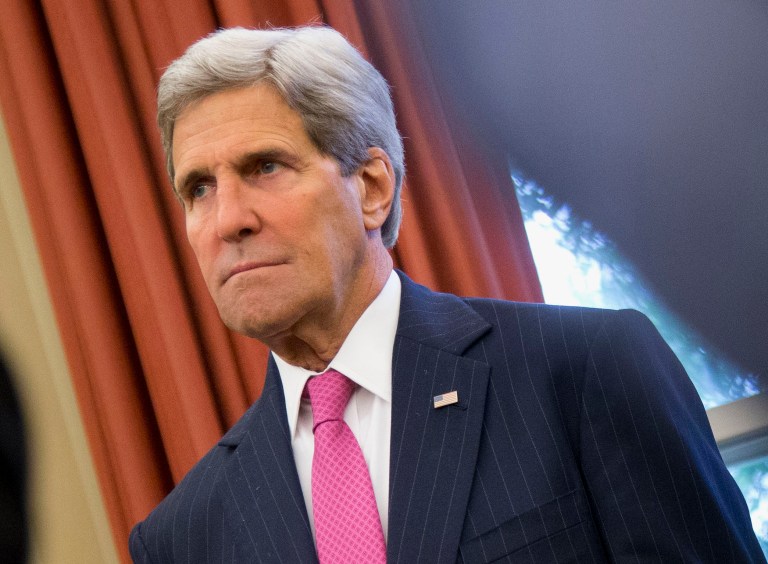 FILE - This June 12, 2014 file photo shows Secretary of State John Kerry listens during a meeting between President Barack Obama and Australian Prime Minister Tony Abbott, in the Oval Office of the White House in Washington. With Baghdad threatened by the advance of an al-Qaida-inspired insurgency, the State Department is reinforcing security at the U.S. Embassy in Iraq's capital _ and sending some personnel out of town. Kerry made calls to foreign ministers in Jordan, the United Arab Emirates, Saudi Arabia and Qatar to discuss the threat and the need for Iraqi leaders to work together. (AP Photo/Pablo Martinez Monsivais, File)