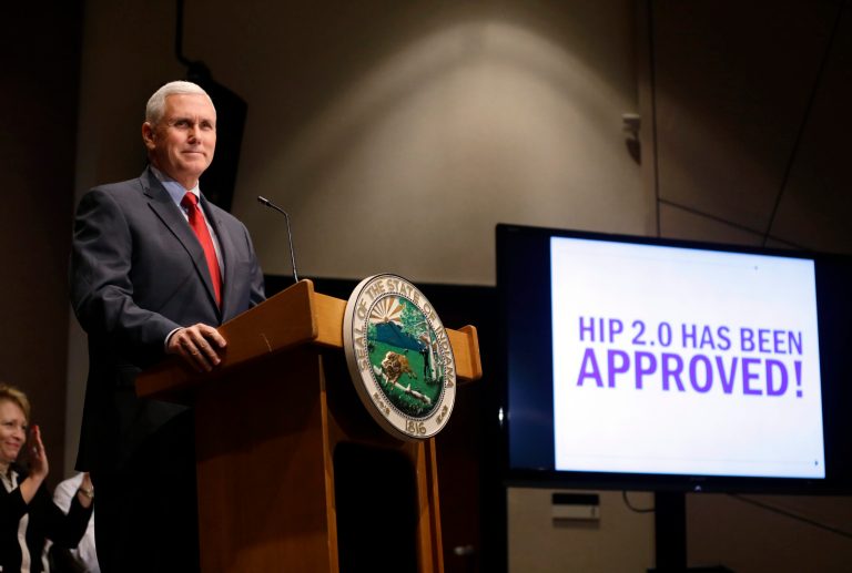 Indiana Gov. Mike Pence announces that the Centers for Medicaid and Medicare Services has approved the state's waiver request for the plan his administration calls HIP 2.0 during a speech in Indianapolis, Tuesday, Jan. 27, 2015. (AP Photo/Michael Conroy)