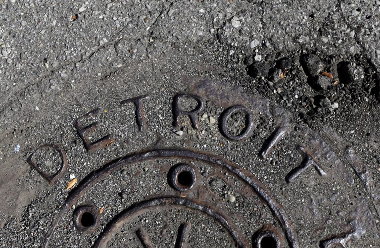 In an Oct. 10, 2013 photo, a manhole cover is seen in Detroit. White House officials have so far rejected the idea of giving the city of Detroit a bailout after federal judge allowed Detroit's bankruptcy to proceed in an order issued earlier today. (AP Photo/Carlos Osorio)