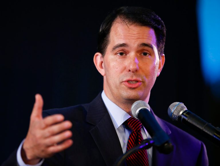 Mary Burke and Gov. Scott Walker, R-Wis., are lining up for a major battle in the race for Wisconsin governor. (AP Photo/Kamil Krzaczynski)