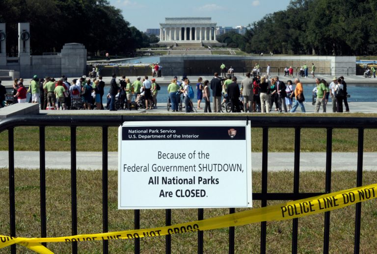 Despite signs stating that the national parks are closed, people visit the World War II Memorial in Washington, Wednesday, Oct. 2, 2013. (AP Photo/Susan Walsh)
