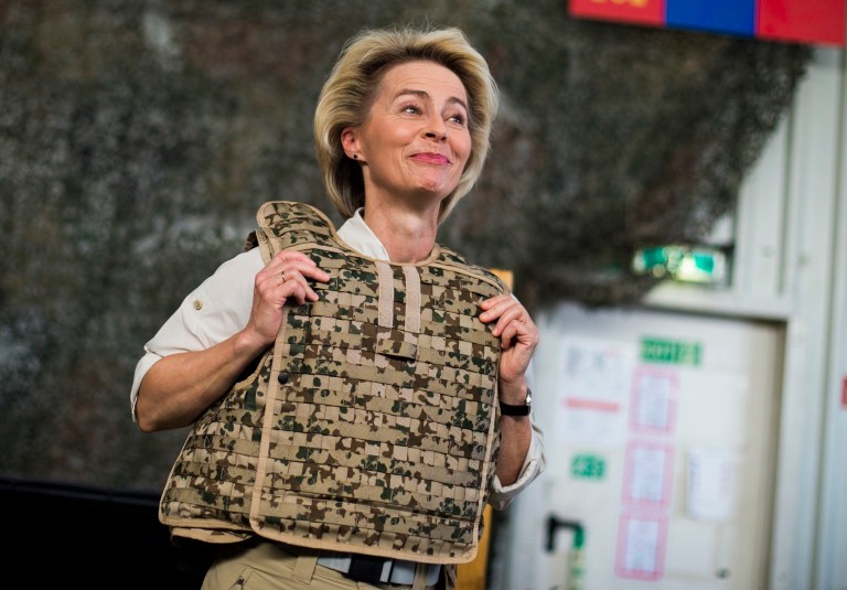 German Defence Minister Ursula von der Leyen wears body armor before boarding a helicopter at Camp Marmal outside Mazar-i-Sharif, Afghanistan, Wednesday, July 23, 2014. (AP Photo/Thomas Peter, Pool)
