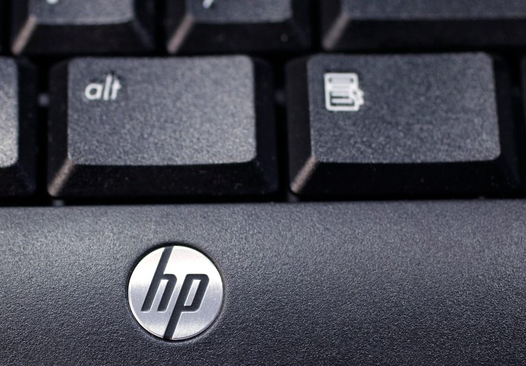 FILE - This Nov. 14, 2011 photo, shows the company logo on a Hewlett-Packard keyboard at the Micro Center computer store in Santa Clara, Calif. Hewlett-Packard on Monday, Oct. 6, 2014 said it is splitting itself into two companies, one focused on its personal computer and printing business and another on technology services, such as data storage, servers and software, as it aims to drive profits higher. (AP Photo/Paul Sakuma, File)