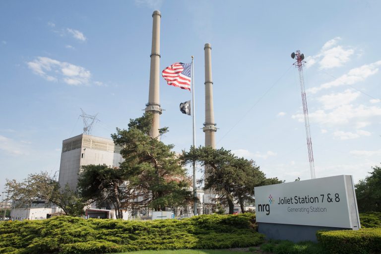 An American flag hangs in front of NRG Energy's Joliet Station power plant on May 7, 2015 in Joliet, Ill. (Photo by Scott Olson/Getty Images)