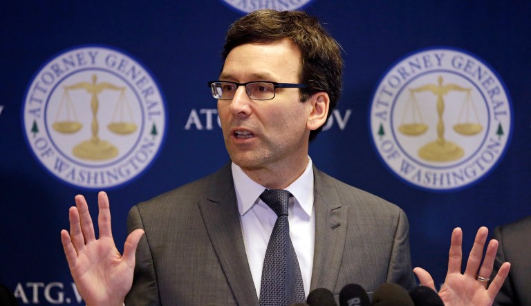 Washington state Attorney General Bob Ferguson (pictured above) and New York Attorney General Eric Schneiderman have announced their intent to challenge the Federal Communications Commission's net neutrality decision in court. (AP Photo/Elaine Thompson)