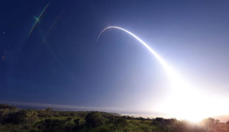 A nuclear missile flies through the sky.