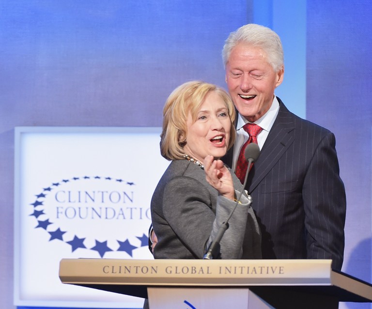 Former Secretary of State Hillary Clinton and husband, former President Bill Clinton address the audience during a Clinton Foundation event. (Michael Loccisano/Getty images)