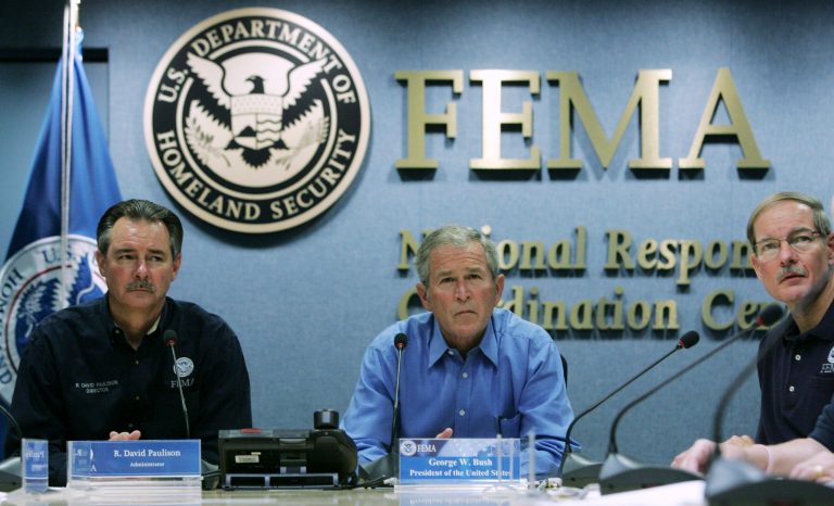 President Bush, center, joined by FEMA Administrator David Paulison, left, and Harvey E. Johnson, Jr., right, receive an update on the preparations for Hurricane Gustav on Aug. 31, 2008, at FEMA Headquarters in Washington. A financial institution is paying lawyers $700 per hour to help Livingston Parish fight FEMA's denials of $60 million in claims for Gustav-related cleanup costs. (AP Photo/Haraz N. Ghanbari)