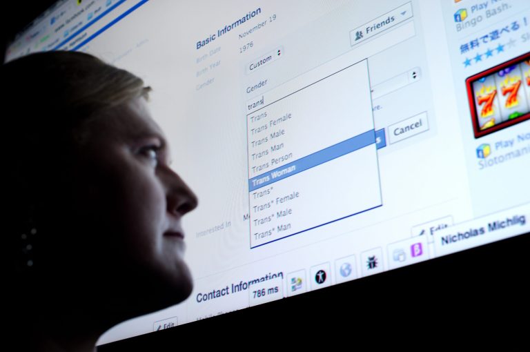 In this Wednesday, Feb. 12, 2014, Facebook software engineer Brielle Harrison demonstrates expanded options for gender identification at her company's Menlo Park, Calif., headquarters. Harrison, who helped engineer the project, plans to switch her identifier to 