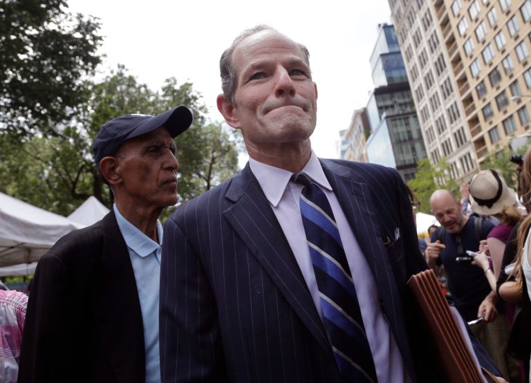 Former New York Gov. Eliot Spitzer walks through Union Square while he tries to collect signatures for his run for New York City comptroller. (AP Photo/Seth Wenig)