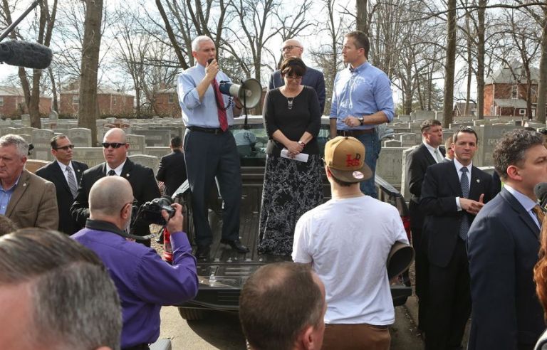 Vice President Mike Pence talks to the assembled crowd at the Chesed Shel Emeth Cemetery in University City, Mo., on Wednesday, Feb. 22, 2017, about the damage done over the weekend when more than 150 headstones were overturned by vandals. (J.B. Forbes /St. Louis Post-Dispatch via AP)