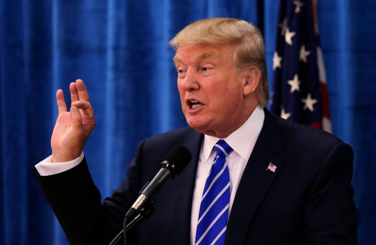 Republican presidential candidate Donald Trump gestures during a campaign stop at Winnacunnet High School in Hampton, N.H., Friday, Aug. 14, 2015. (AP Photo/Charles Krupa)