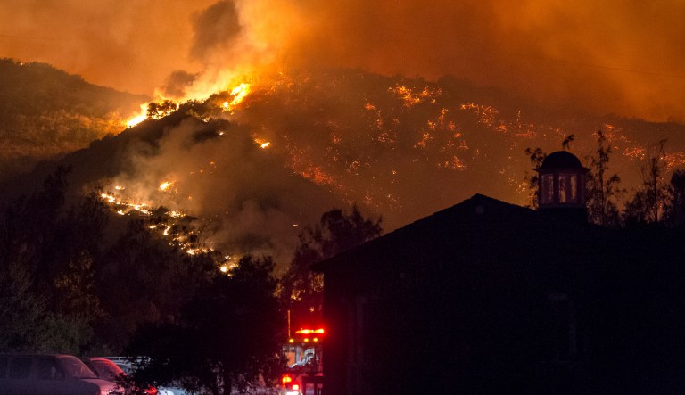 The Thomas fire alone has consumed more than 230,000 acres, forcing thousands to evacuate, and causing Trump to issue a federal state of emergency in California. (Kenneth Song/Santa Barbara News-Press via AP)