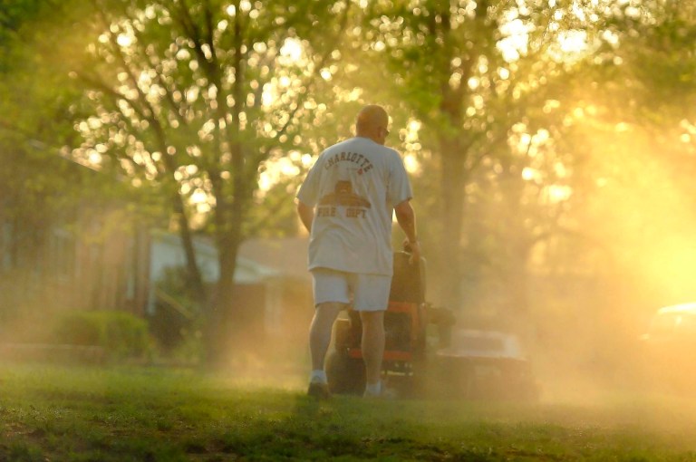FILE - In a Monday, April 5, 2010, file photo, Shane Nantz kicks up a cloud of pollen as he mows the front yard of his west Charlotte, N.C., home. Seasonal allergy sufferers can try newly FDA-approved types of immnotherapy, once-a-day tablets containing freeze-dried grass extract that dissolve quickly under the tongue, steadily lessening the excessive immune reaction much like the shots. (AP Photo/The Charlotte Observer, Todd Sumlin, File)