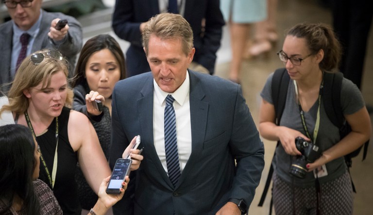 Sen. Jeff Flake, R-Ariz., and other senators arrive for weekly policy meetings on Capitol Hill in Washington, Tuesday, July 11, 2017. (AP Photo/J. Scott Applewhite)
