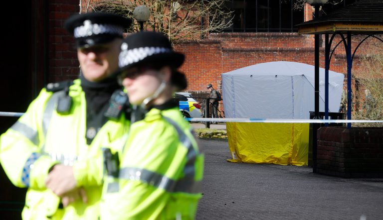 In this photo from Tuesday, police officers secure the area as a police tent covers the spot in Salisbury, England, where former Russian spy double agent Sergei Skripal and his daughter were found critically ill Sunday following exposure to a nerve agent. The two Russians are in critical condition. (AP Photo/Frank Augstein)