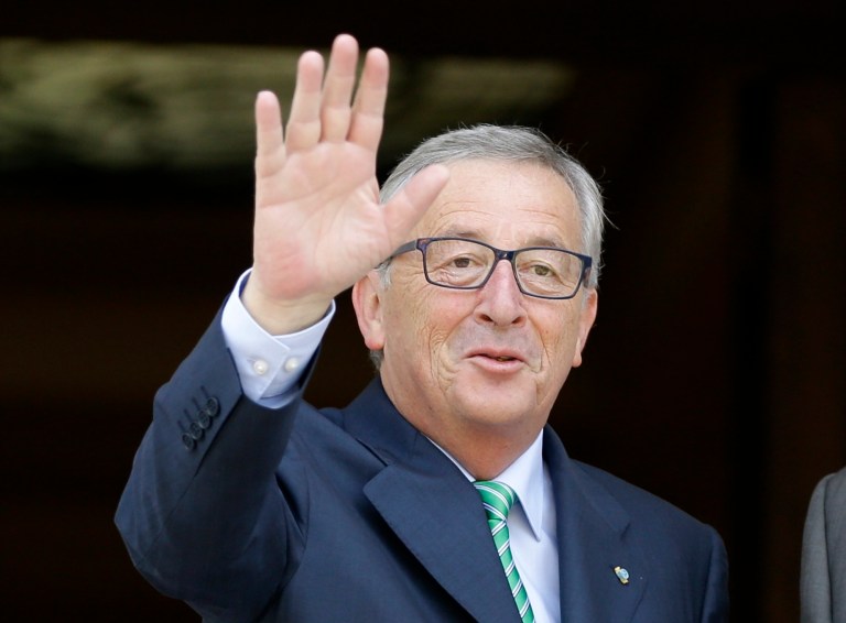 Jean-Claude Juncker, president-elect of the European Commission, left, waves to the media at the Maximos Mansion in Athens, Monday, Aug. 4, 2014. Juncker is visit Athens in his first trip since his election by the new European Parliament last month. He meets Greek Prime Minister Antonis Samaras, a fellow conservative, to express support for the country's ongoing effort to make its public finances sustainable. (AP Photo/Thanassis Stavrakis)