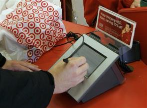More Americans are using credit cards where they once used cash. AP Photo