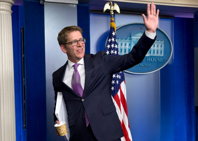 Outgoing White House press secretary Jay Carney waves following the conclusion of his final news briefing at the White House in Wednesday, June 18, 2014. This was Carney's last briefing to members of the media, he is stepping down as White House press secretary and Deputy Press Secretary Josh Earnest will step into the role (AP Photo/Jacquelyn Martin)