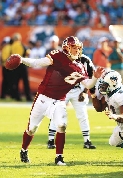 Wilfredo Lee/AP
As bad as Rex Grossman and the Redskins have been this season, they already have more wins than the 1961 team.