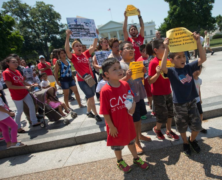 Demonstrators march in front of the White House in Washington, Monday, July 7, 2014, following a news conference of immigrant families and children's advocates responding to the President Barack Obama's response to the crisis of unaccompanied children and families illegally entering the US,  A top Obama administration official says no one, not even children trying to escape violent countries, can illegally enter the United States without eventually facing deportation proceedings. But Homeland Security Sec Jeh Johnson basically acknowledged Sunday that such proceedings might be long delayed, and he said that coping with floods of unaccompanied minors crossing the border is a legal and humanitarian dilemma for the US. (AP Photo/Pablo Martinez Monsivais)