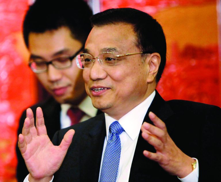 FILE - In this Aug. 30, 2012 file photo, Chinese Vice Premier Li Keqiang meets with German Chancellor Angela Merkel in Beijing. China's economic model that delivered three decades of double-digit growth is running out of steam and the country's next leaders face tough choices to keep incomes rising. Li is the man in line to lead reforms as the next premier, China's top economic official. (AP Photo/How Hwee Young, Pool, File)