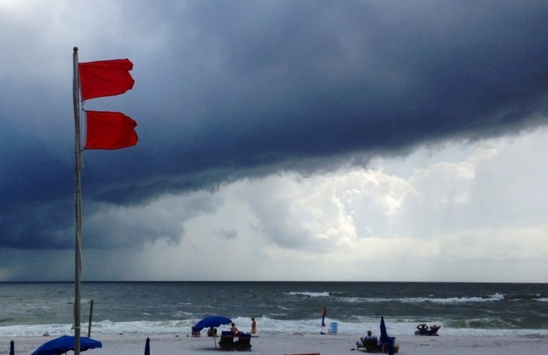 Red flags warn swimmers to stay out of the Gulf of Mexico as a squall from Tropical Storm Karen moves offshore at Gulf Shores, Ala., on Saturday.ÃÂ Despite having many workers furloughed and others working without pay, FEMA has made efforts to help residents preparing for Tropical Storm Karen as well as severe weather that has battered parts of the Midwest.ÃÂ (AP Photo/Jay Reeves)