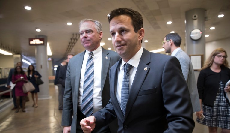 Sen. Tim Kaine, D-Va., left, and Sen. Brian Schatz, D-Hawaii, head to the Senate for a weekly Democratic caucus luncheon at the Capitol in Washington, Wednesday, Sept. 6, 2017. (AP Photo/J. Scott Applewhite)
